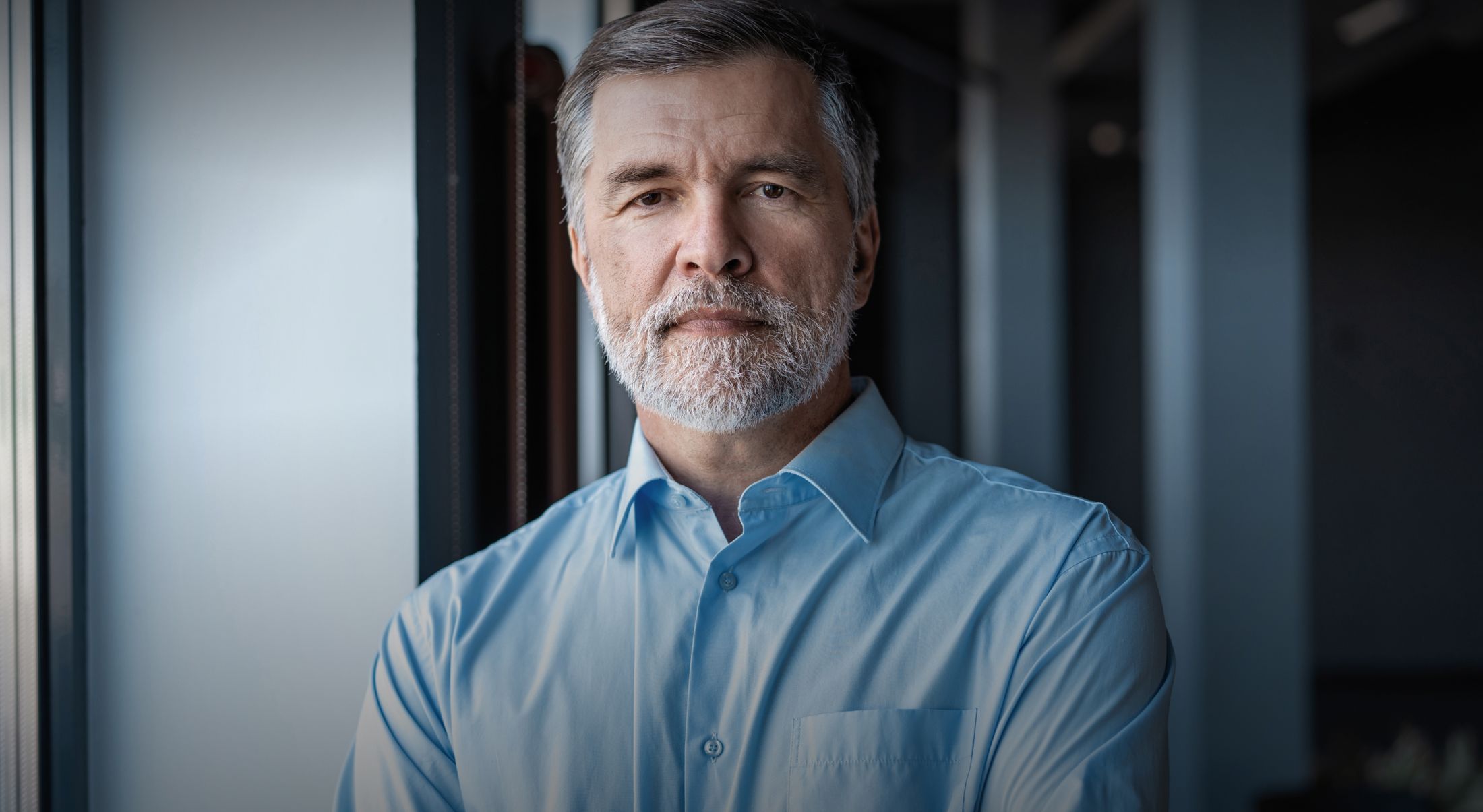 San Francisco Hair Transplant model wearing a blue shirt