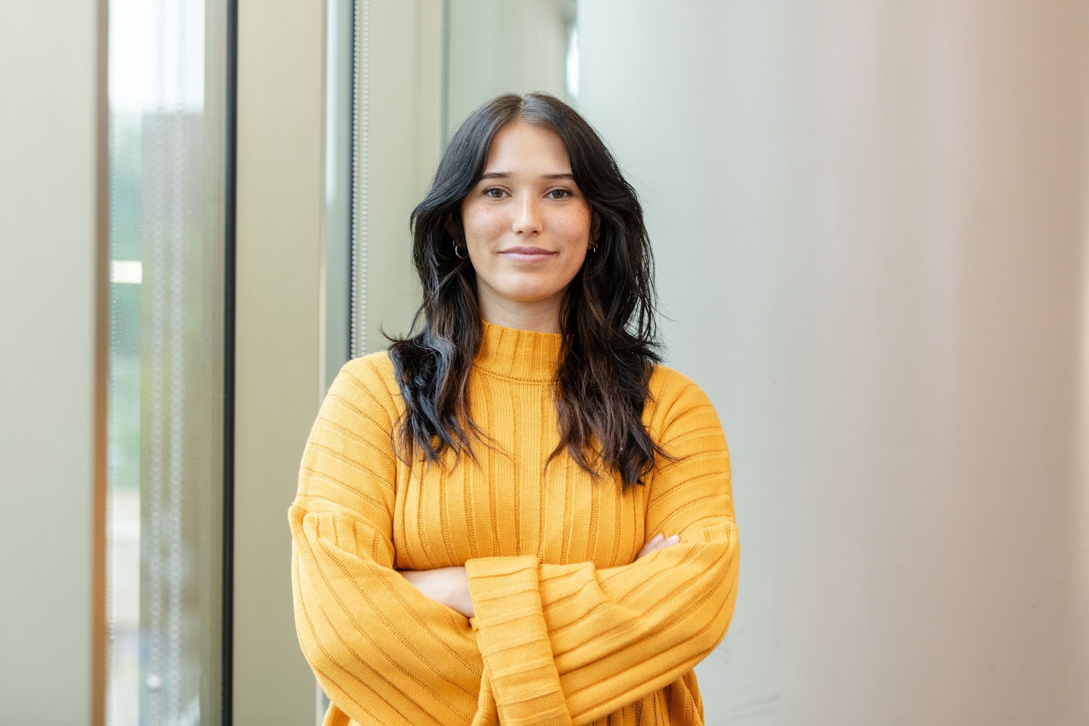 San Francisco forehead reduction surgery model wearing yellow sweater